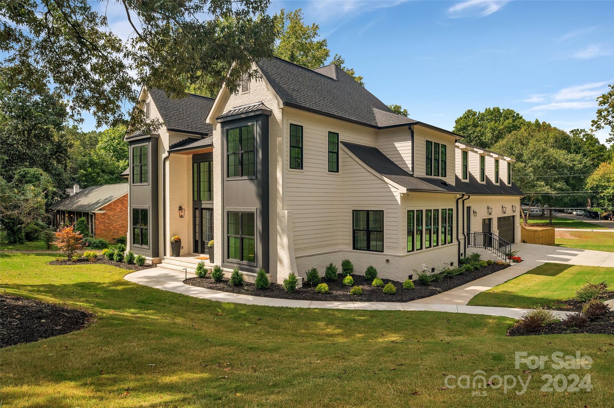 3500 Barclay Downs Drive Charlotte, NC 28209 - Photo 2 of 48 a front view of a house with yard swimming pool and outdoor seating