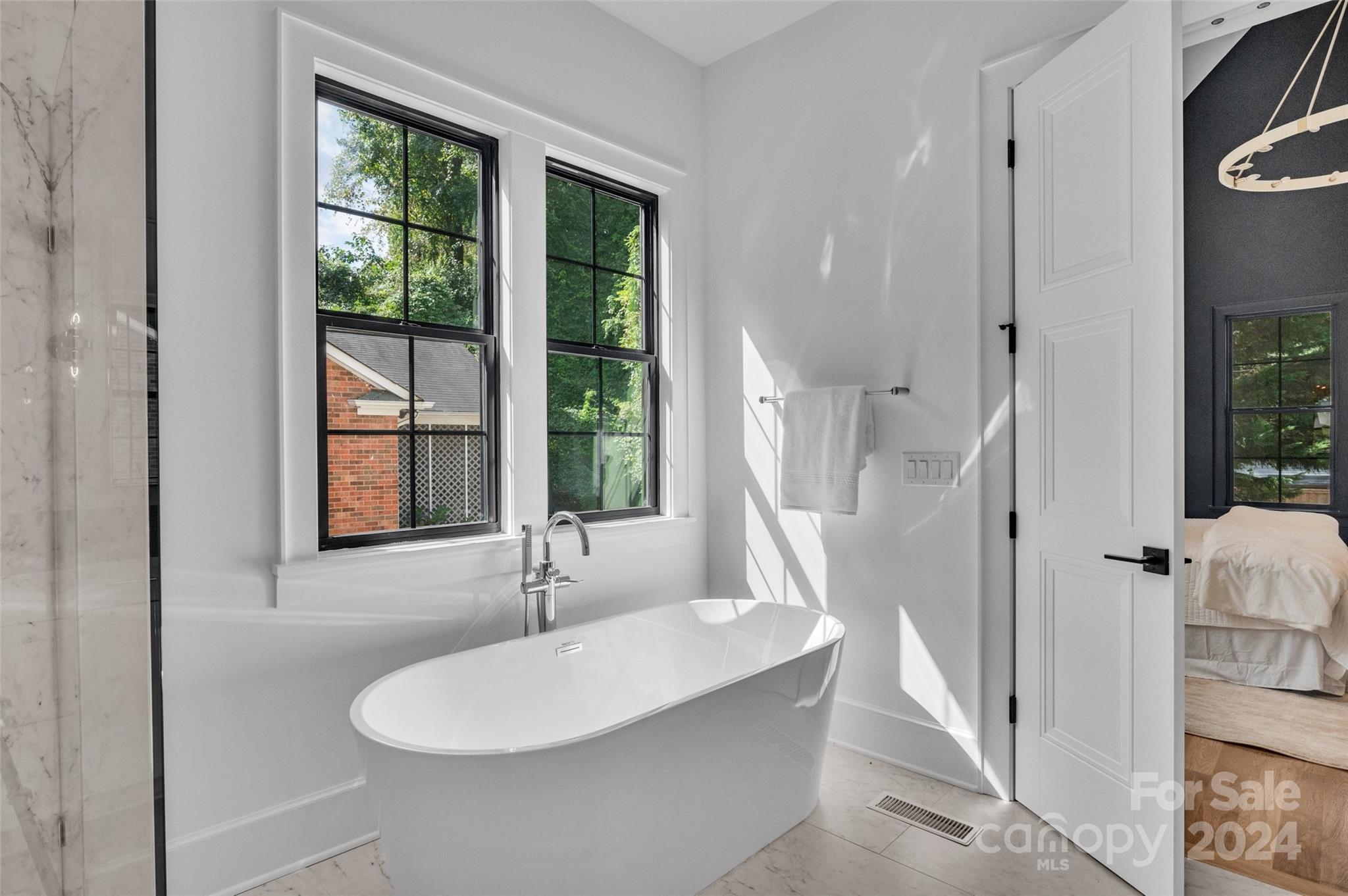 3500 Barclay Downs Drive Charlotte, NC 28209 - Photo 26 of 48 a bath room with a sink and a mirror