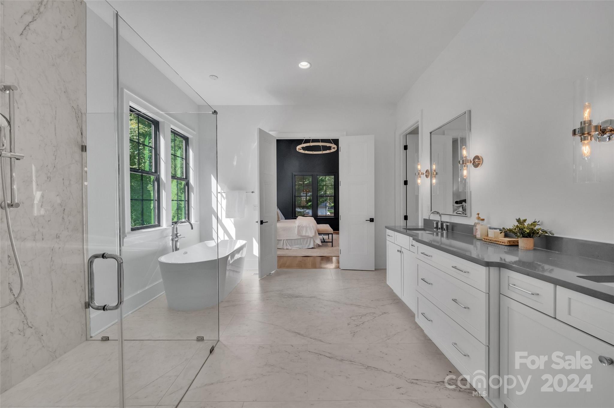 3500 Barclay Downs Drive Charlotte, NC 28209 - Photo 28 of 48 a spacious bathroom with double vanity a large mirror a bathtub and a shower