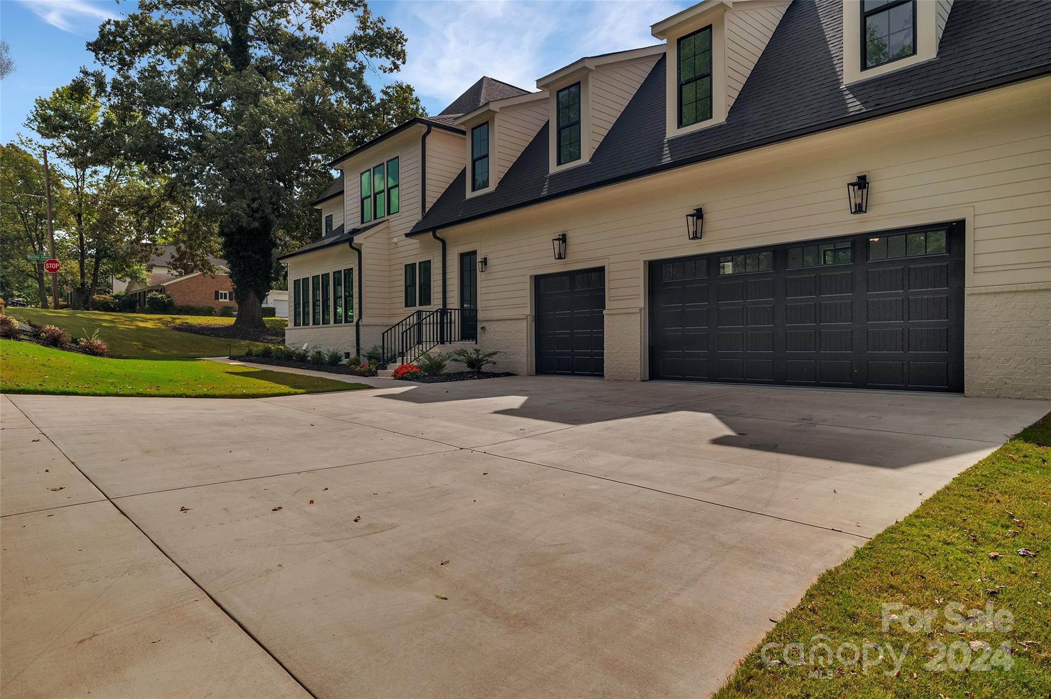 3500 Barclay Downs Drive Charlotte, NC 28209 - Photo 3 of 48 a front view of a house with a yard and garage