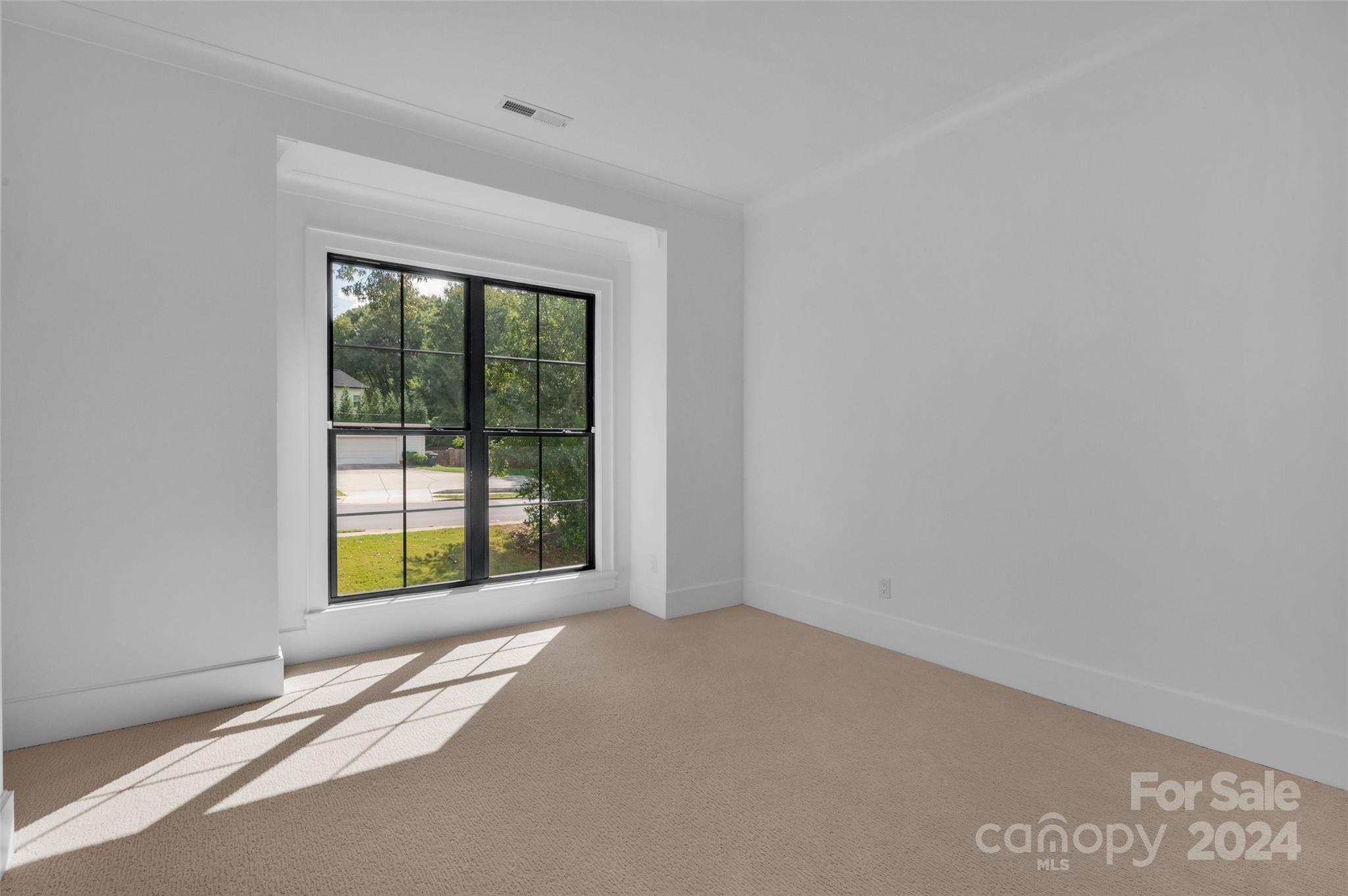 3500 Barclay Downs Drive Charlotte, NC 28209 - Photo 31 of 48 a view of an empty room with a window