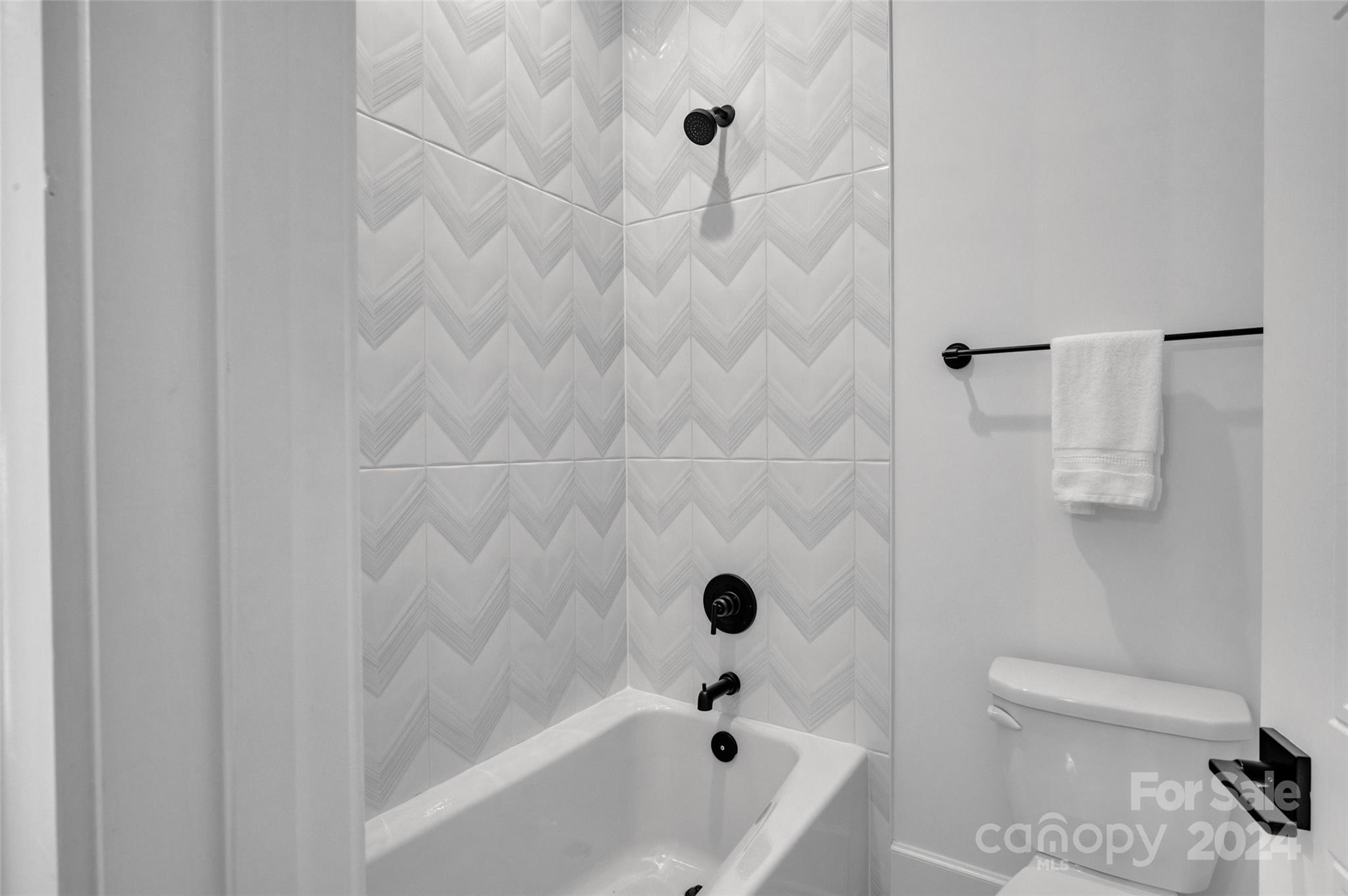 3500 Barclay Downs Drive Charlotte, NC 28209 - Photo 34 of 48 a bathroom with a bathtub and a toilet