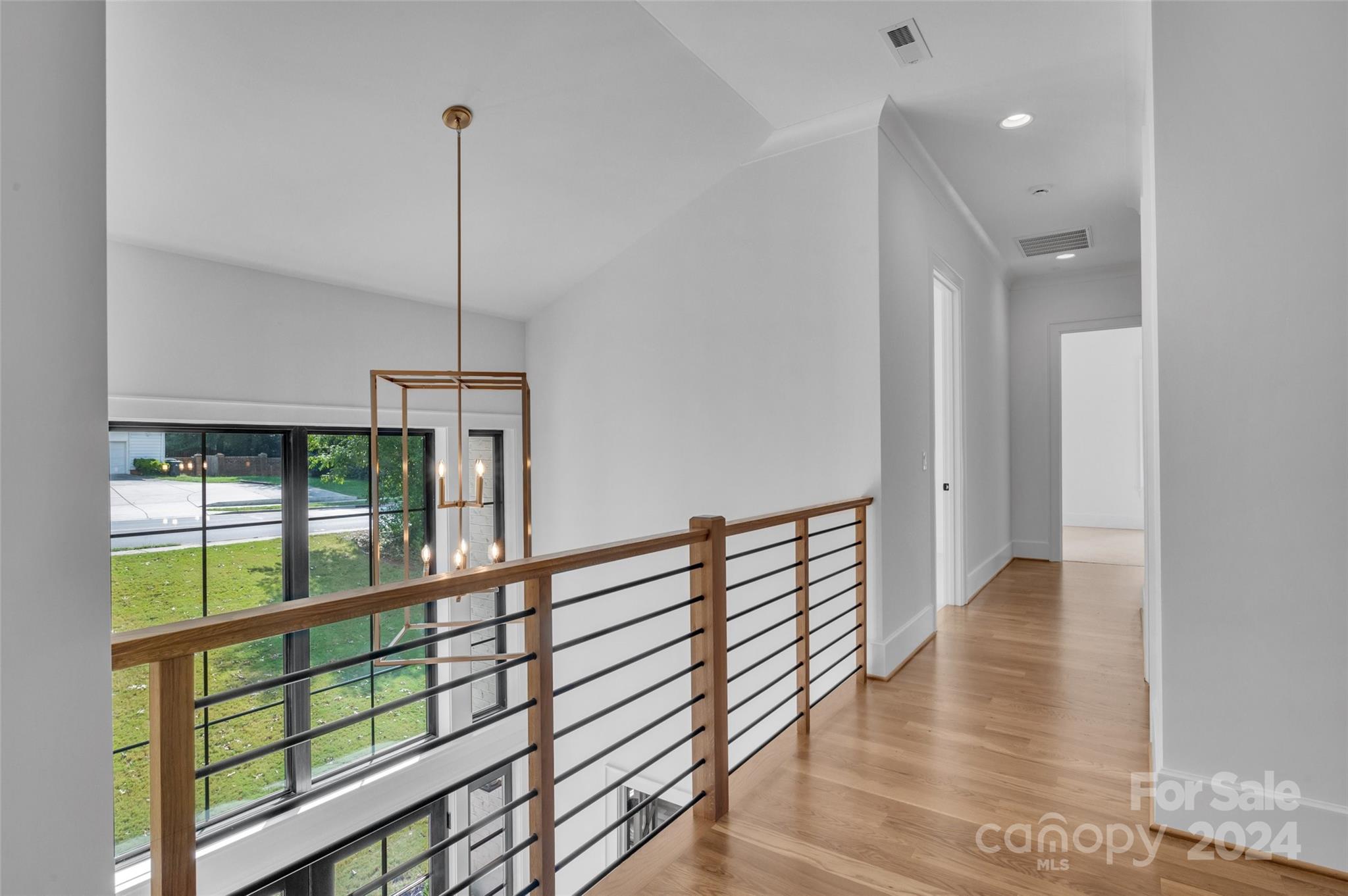 3500 Barclay Downs Drive Charlotte, NC 28209 - Photo 35 of 48 a view of hallway with wooden floor