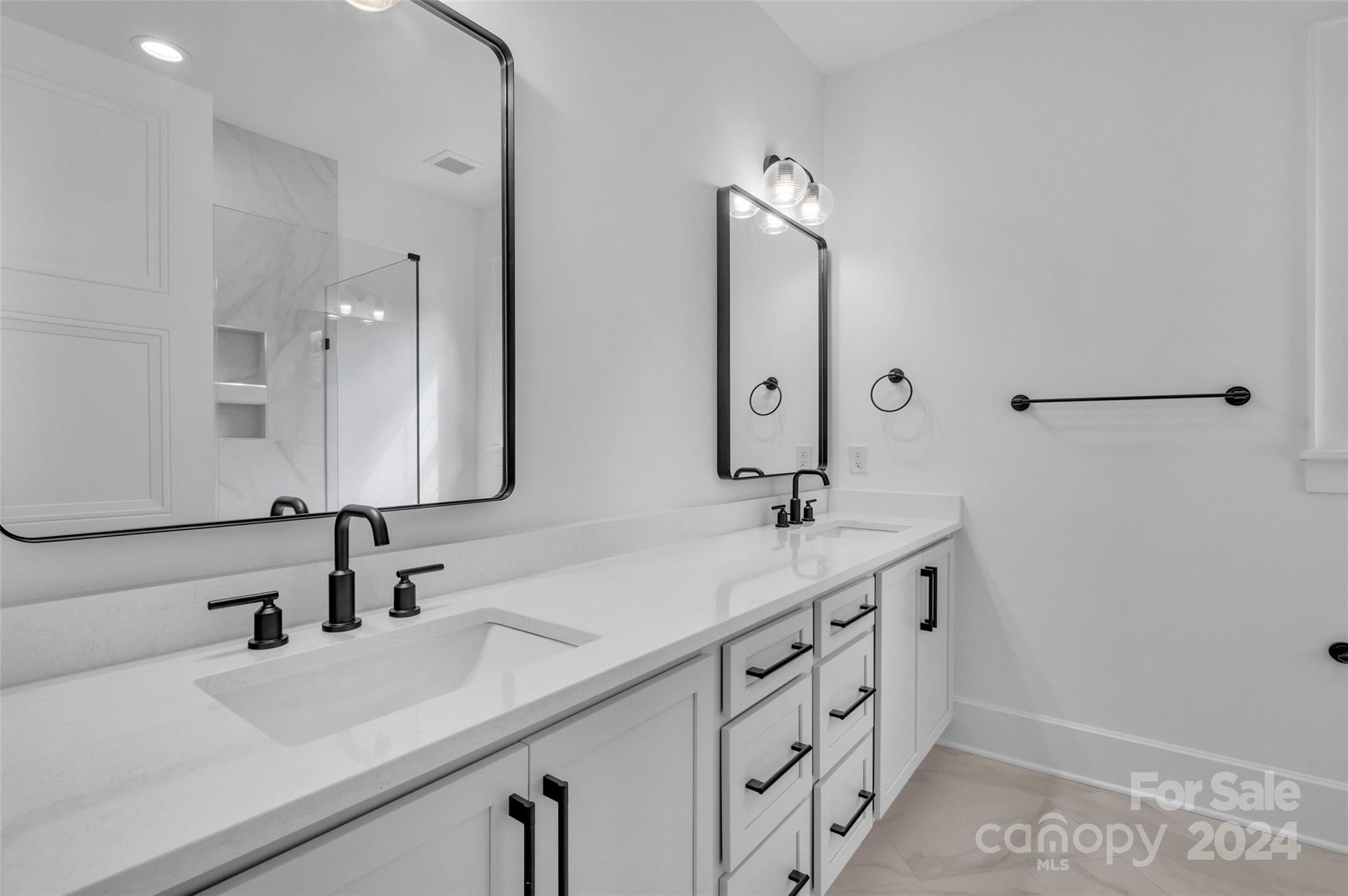 3500 Barclay Downs Drive Charlotte, NC 28209 - Photo 44 of 48 a bathroom with double sink and two mirror