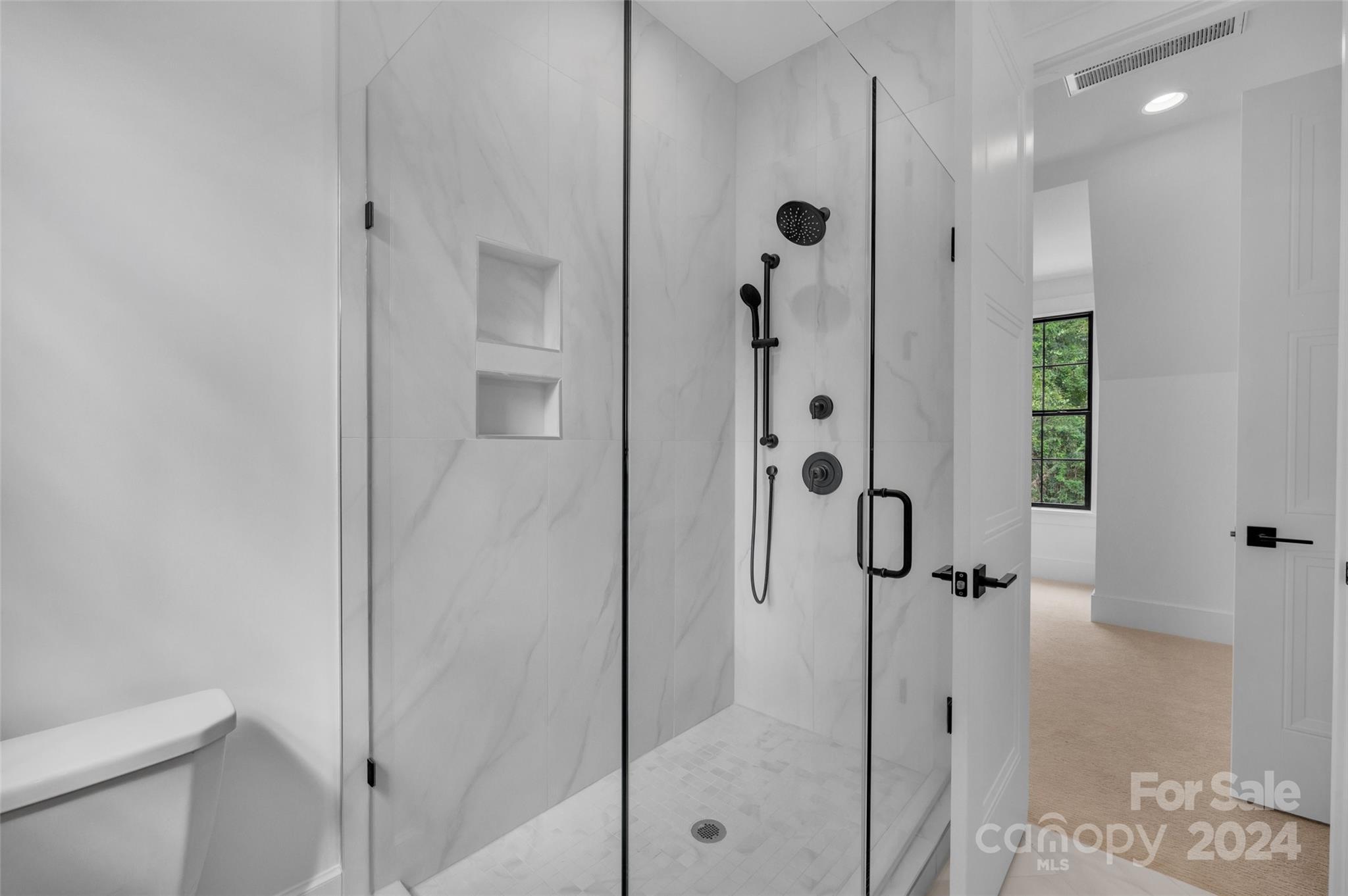 3500 Barclay Downs Drive Charlotte, NC 28209 - Photo 45 of 48 a bathroom with a shower and a toilet