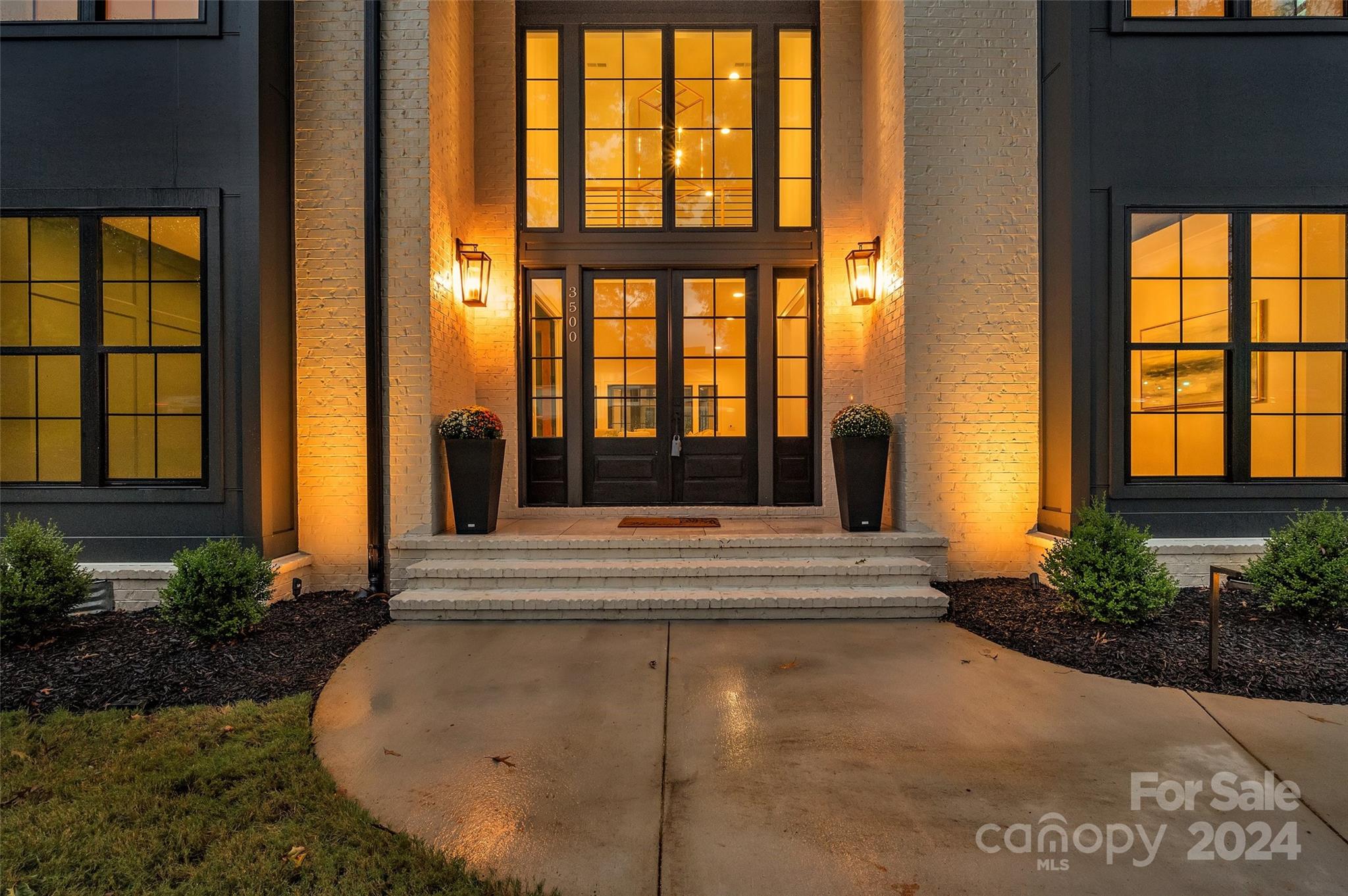 3500 Barclay Downs Drive Charlotte, NC 28209 - Photo 6 of 48 a living room filled with furniture and a floor to ceiling window
