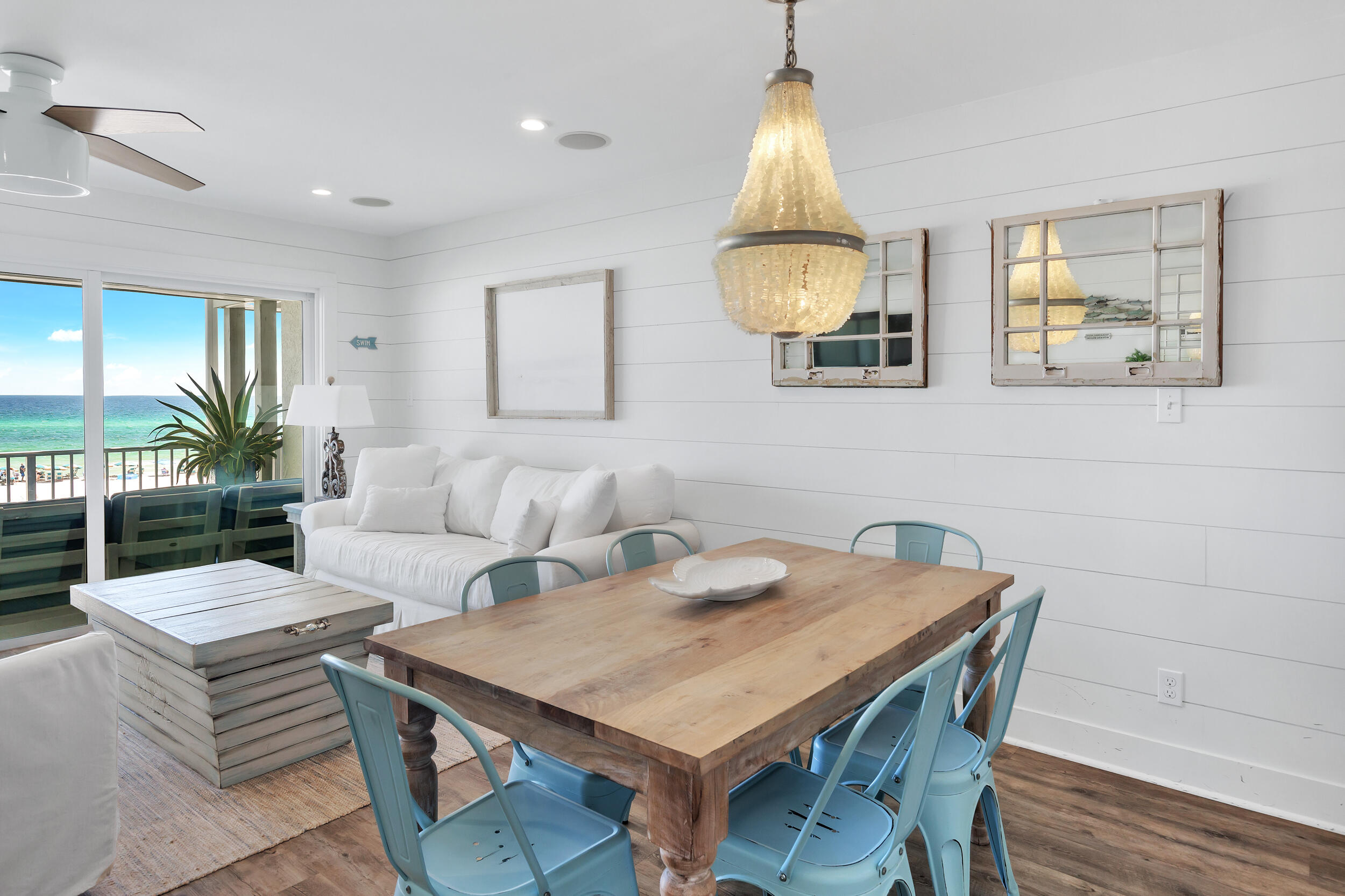 561 Eastern Lake Road, Unit 202 Santa Rosa Beach, FL 32459 - Photo 13 of 32 a view of a dining room with furniture and a potted plant
