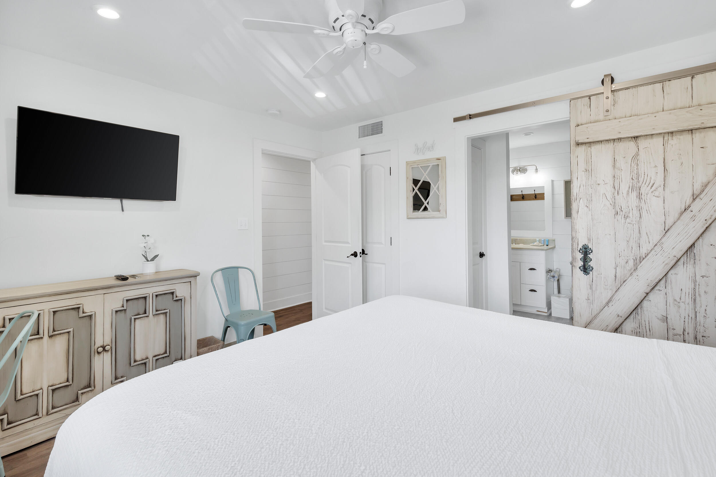 561 Eastern Lake Road, Unit 202 Santa Rosa Beach, FL 32459 - Photo 14 of 32 a bedroom with a bed and a flat screen tv