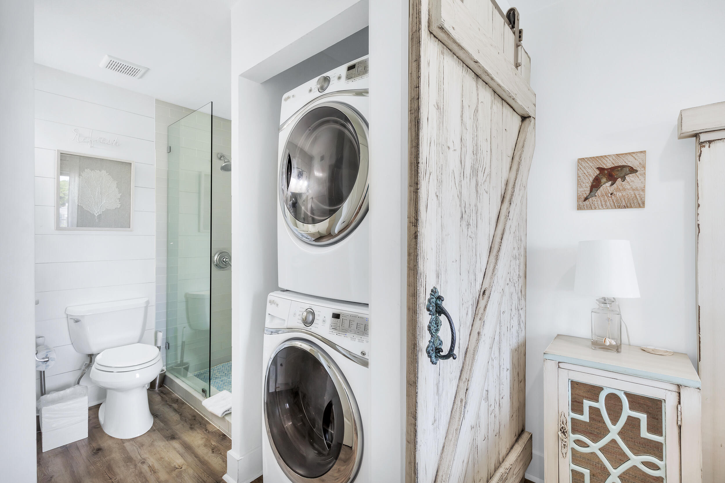 561 Eastern Lake Road, Unit 202 Santa Rosa Beach, FL 32459 - Photo 15 of 32 a view of a hallway with washer and dryer