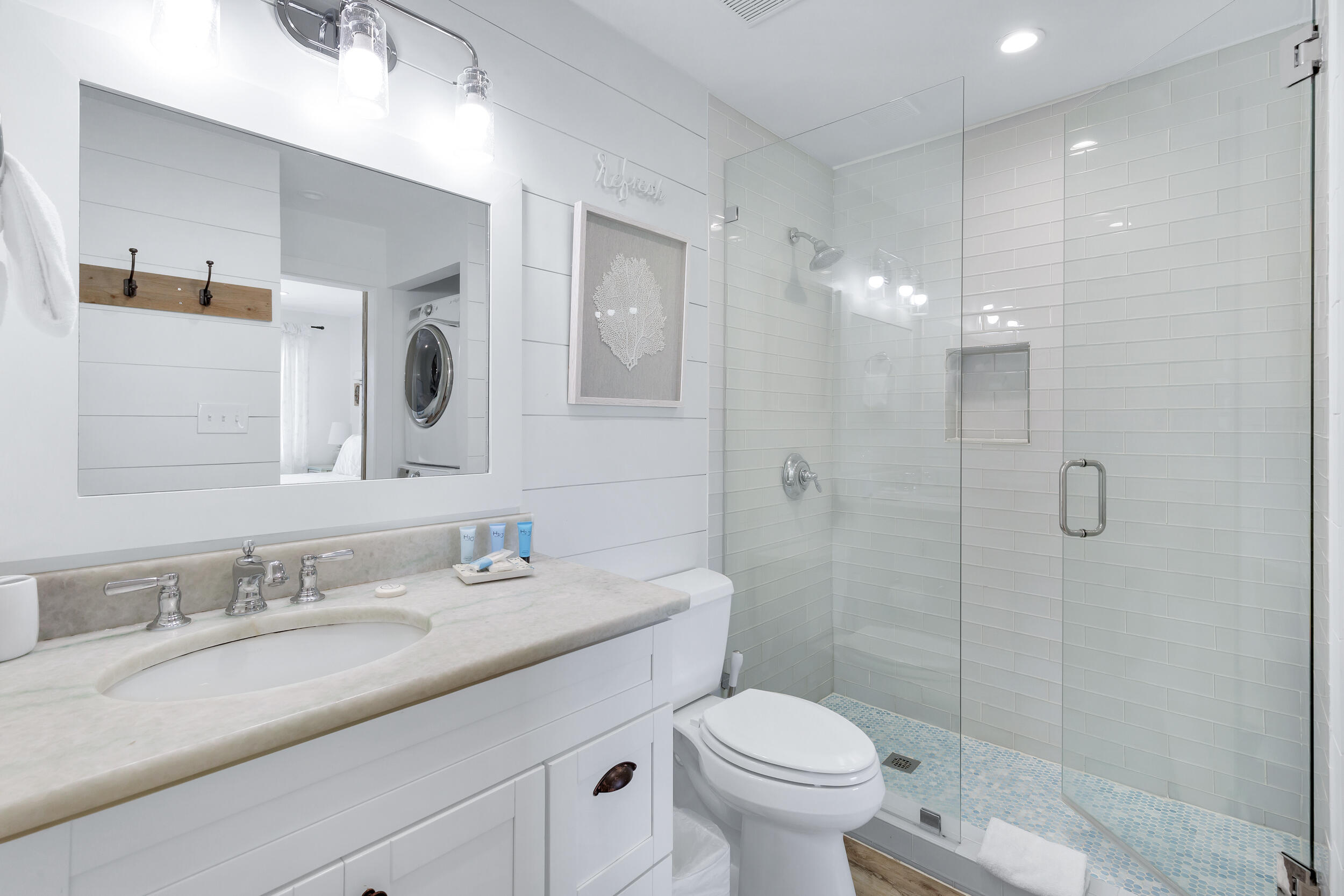 561 Eastern Lake Road, Unit 202 Santa Rosa Beach, FL 32459 - Photo 16 of 32 a bathroom with a granite countertop sink toilet and shower