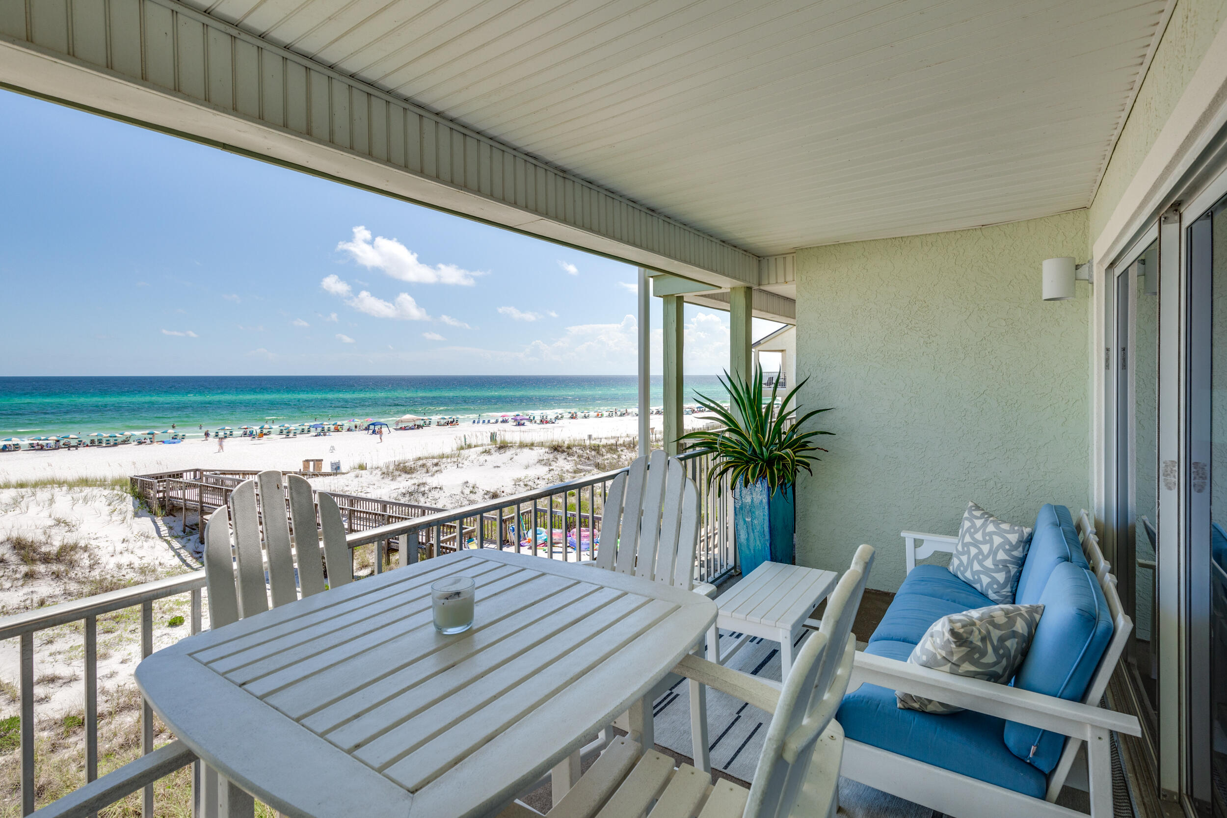 561 Eastern Lake Road, Unit 202 Santa Rosa Beach, FL 32459 - Photo 19 of 32 a view of a balcony dining room and wooden floor