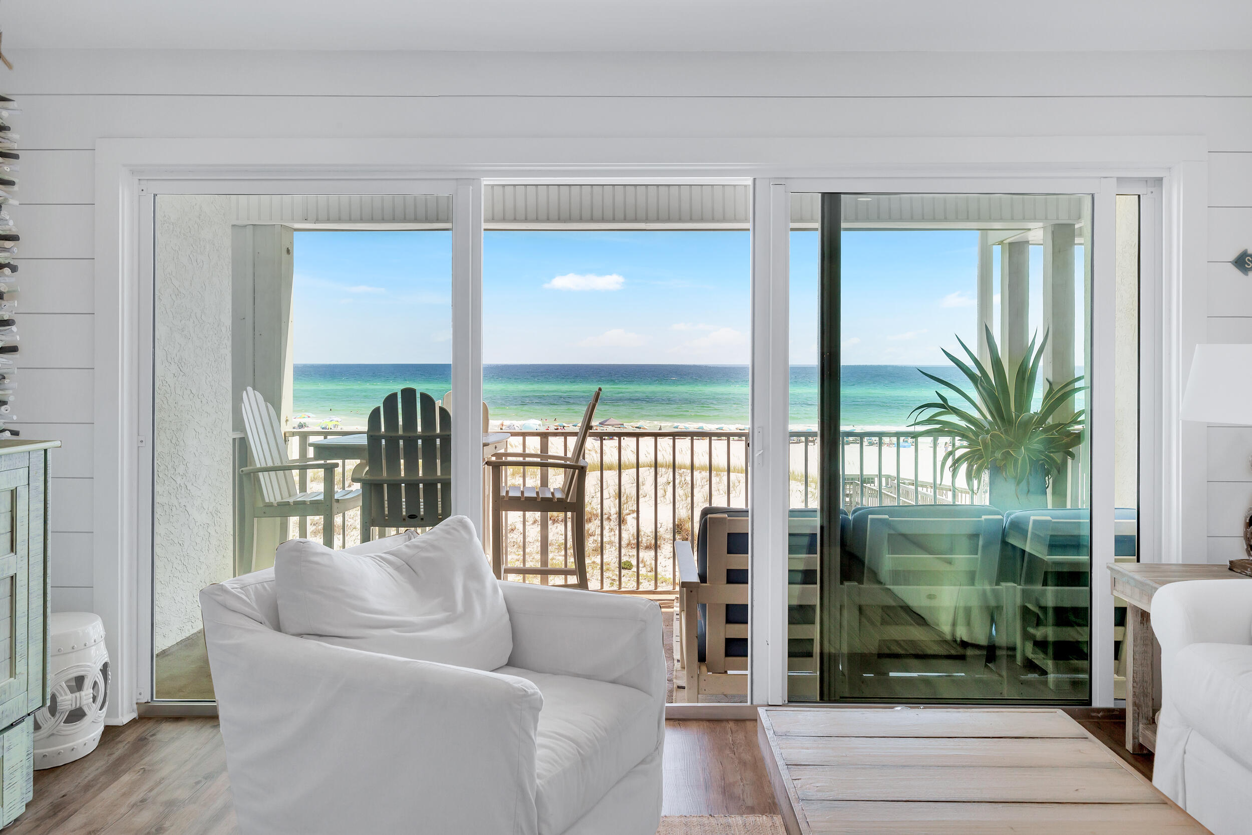 561 Eastern Lake Road, Unit 202 Santa Rosa Beach, FL 32459 - Photo 2 of 32 a living room with furniture and a floor to ceiling window