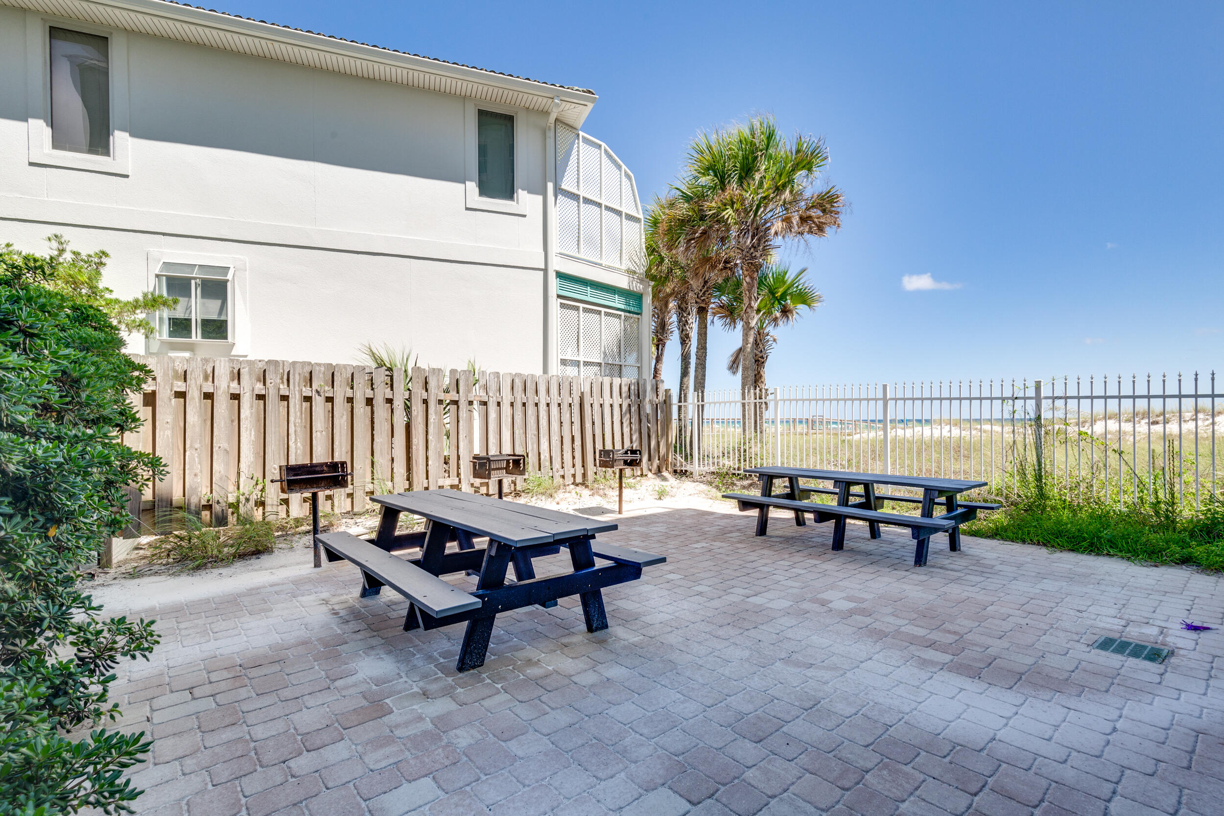 561 Eastern Lake Road, Unit 202 Santa Rosa Beach, FL 32459 - Photo 23 of 32 a swimming pool with outdoor seating and yard