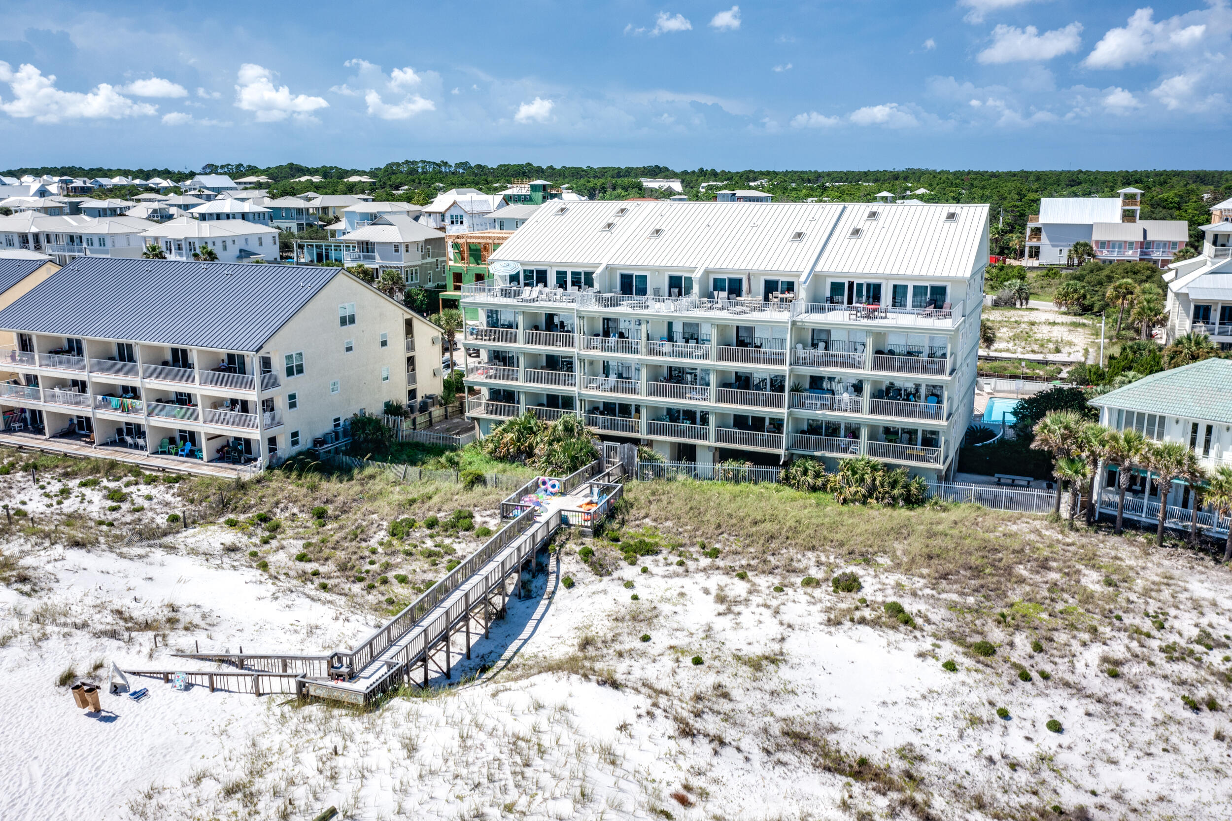 561 Eastern Lake Road, Unit 202 Santa Rosa Beach, FL 32459 - Photo 32 of 32 a view of a wooden house with a yard