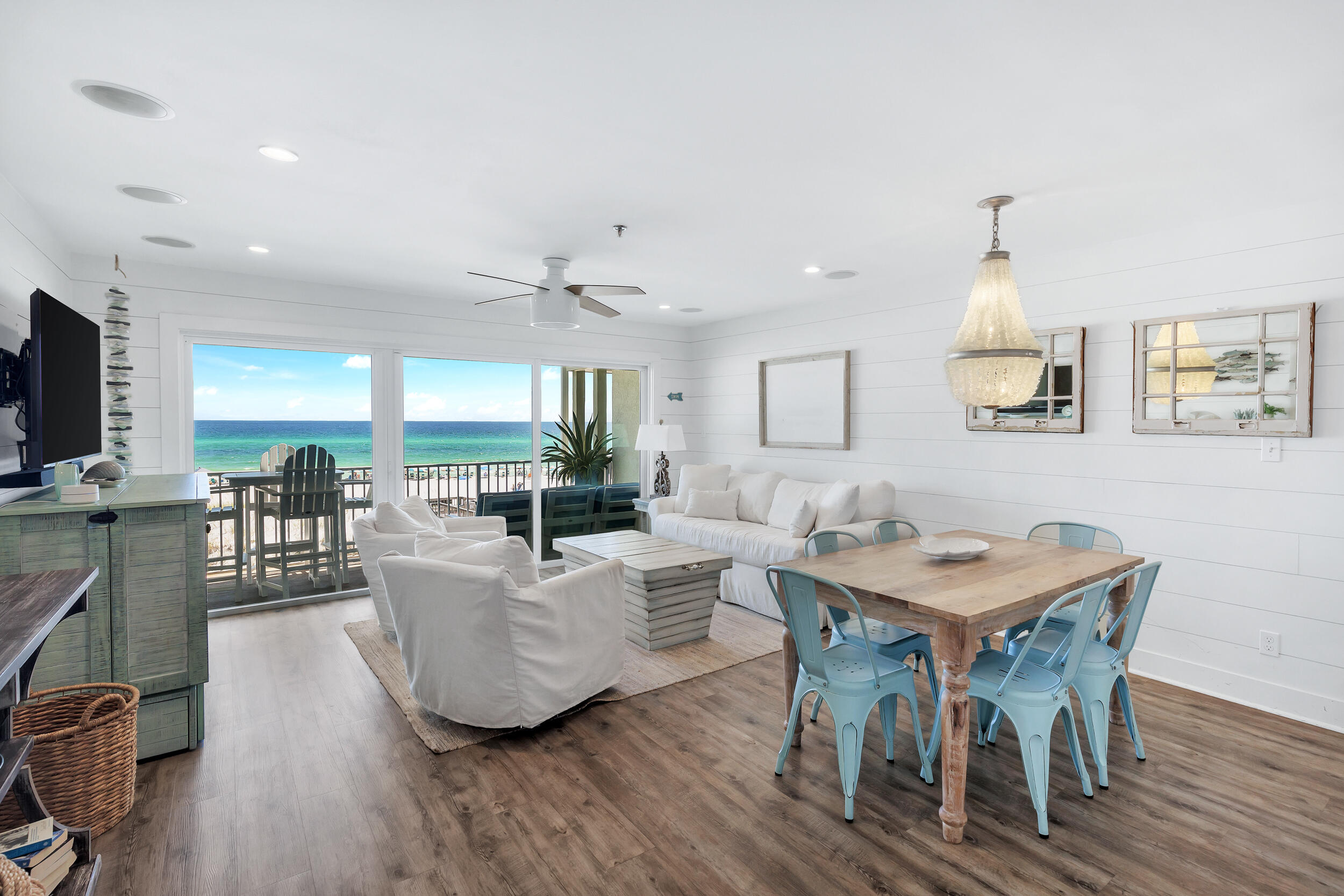 561 Eastern Lake Road, Unit 202 Santa Rosa Beach, FL 32459 - Photo 6 of 32 a living room with furniture a flat screen tv and a wooden floor