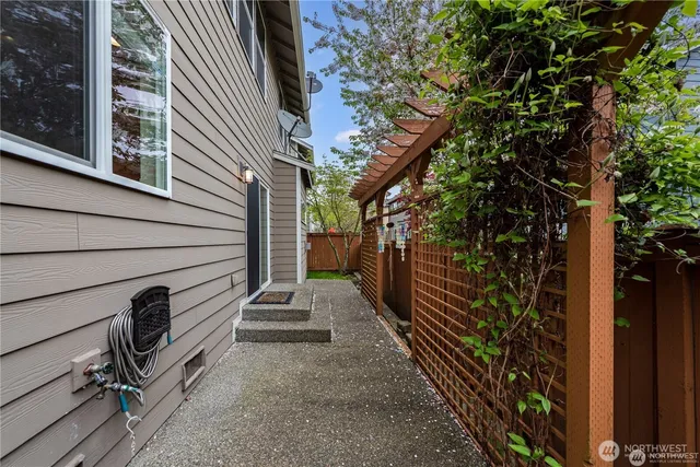 a view of a pathway of a house with wooden stairs