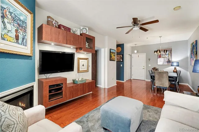 a living room with furniture fireplace and flat screen tv