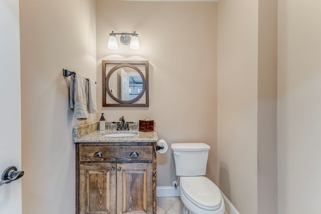 382 Adventure Trail Ellijay, GA 30536 - Photo 18 of 75 a bathroom with a toilet a sink and mirror