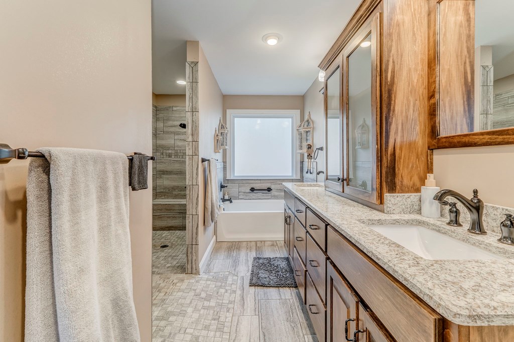382 Adventure Trail Ellijay, GA 30536 - Photo 24 of 75 a bathroom with a granite countertop sink and a mirror