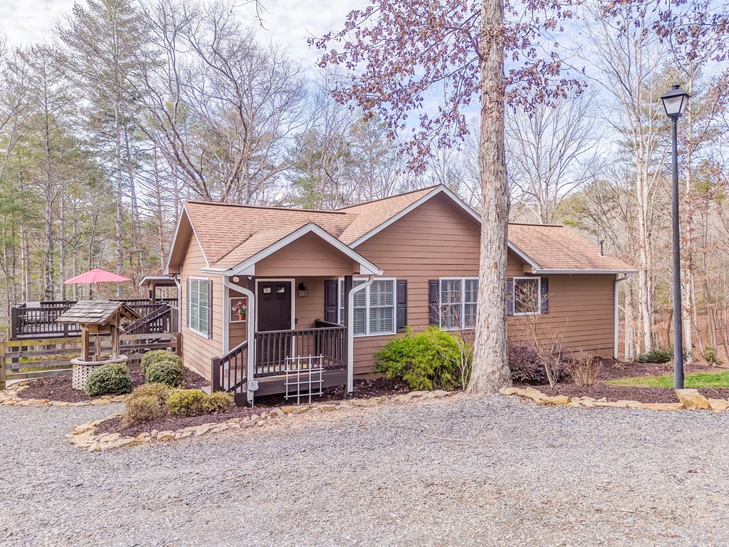 382 Adventure Trail Ellijay, GA 30536 - Photo 4 of 75 a front view of a house with garden