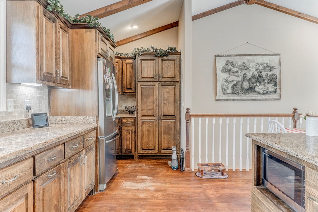 382 Adventure Trail Ellijay, GA 30536 - Photo 52 of 75 a kitchen with stainless steel appliances granite countertop a refrigerator oven a sink and dishwasher