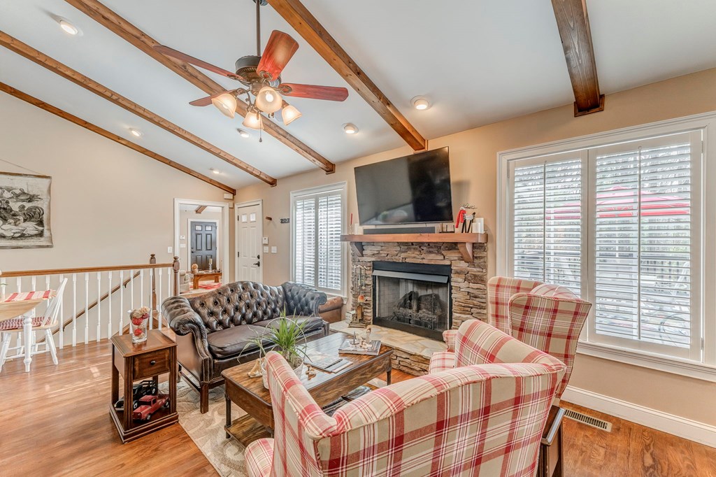 382 Adventure Trail Ellijay, GA 30536 - Photo 55 of 75 a living room with furniture a fireplace and a flat screen tv