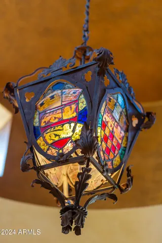 a bedroom with a bed mirror and window