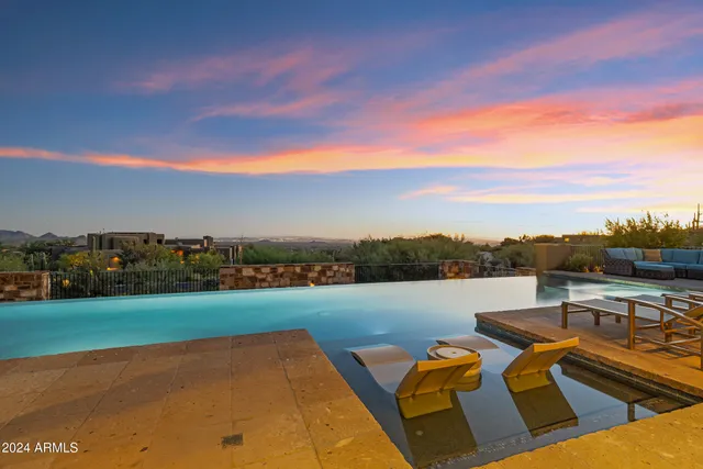 a large bathroom with a large tub and sink