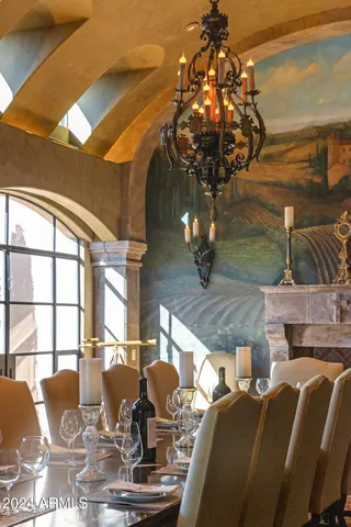 a kitchen with a table chairs and a stove