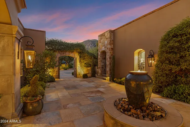 a dining room with furniture and chandelier