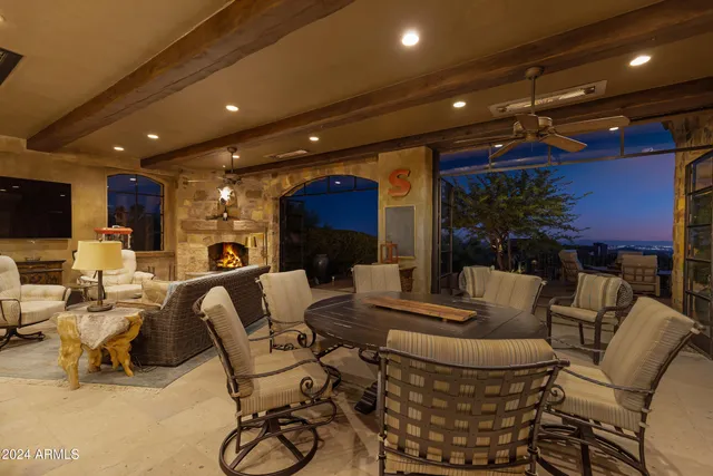 a view of a terrace with couches and a couple of ocean view