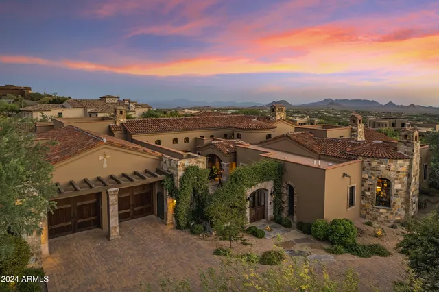 a view of a city with mountains in the background
