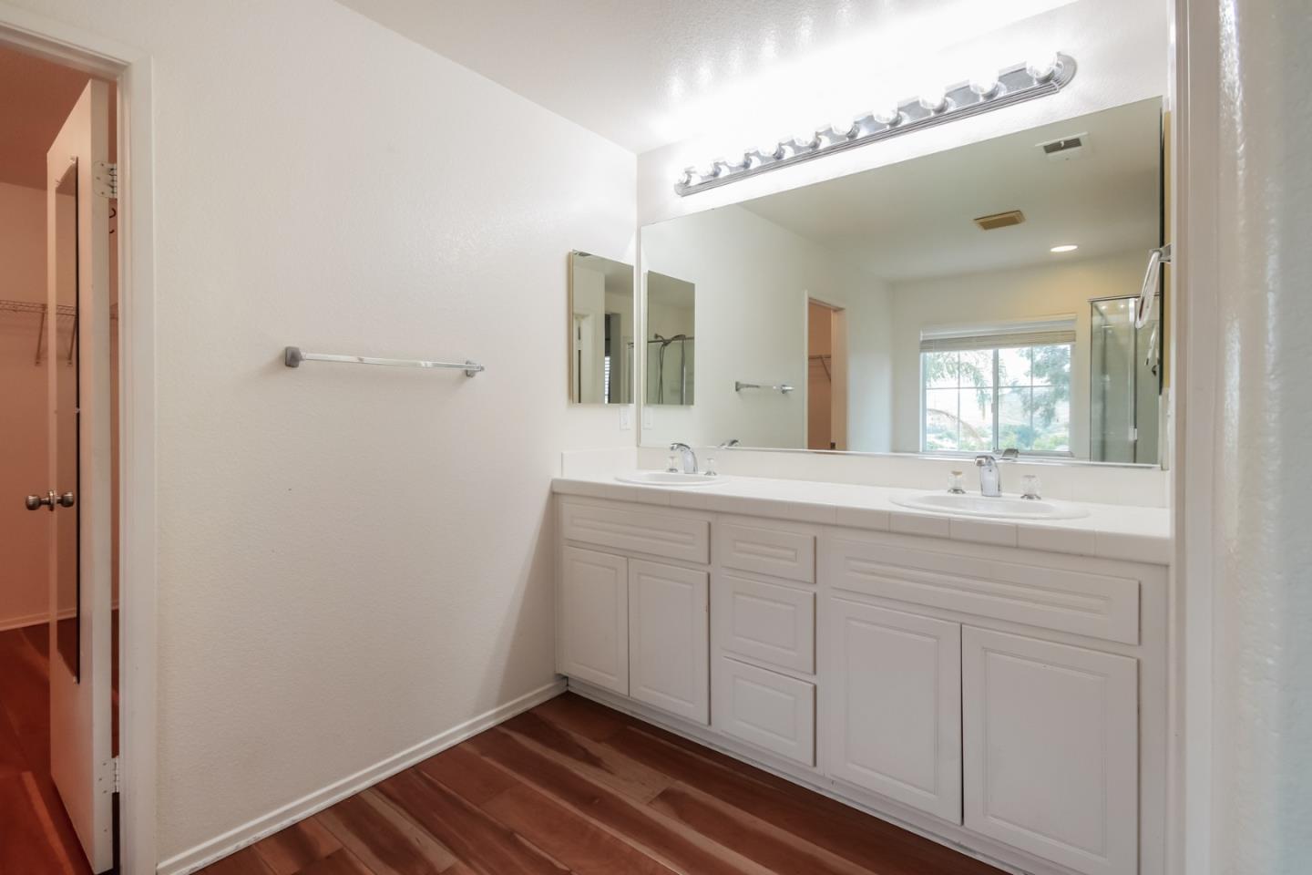 1103 Greenway Road Oceanside, CA 92057 - Photo 14 of 24 a bathroom with a sink and a mirror