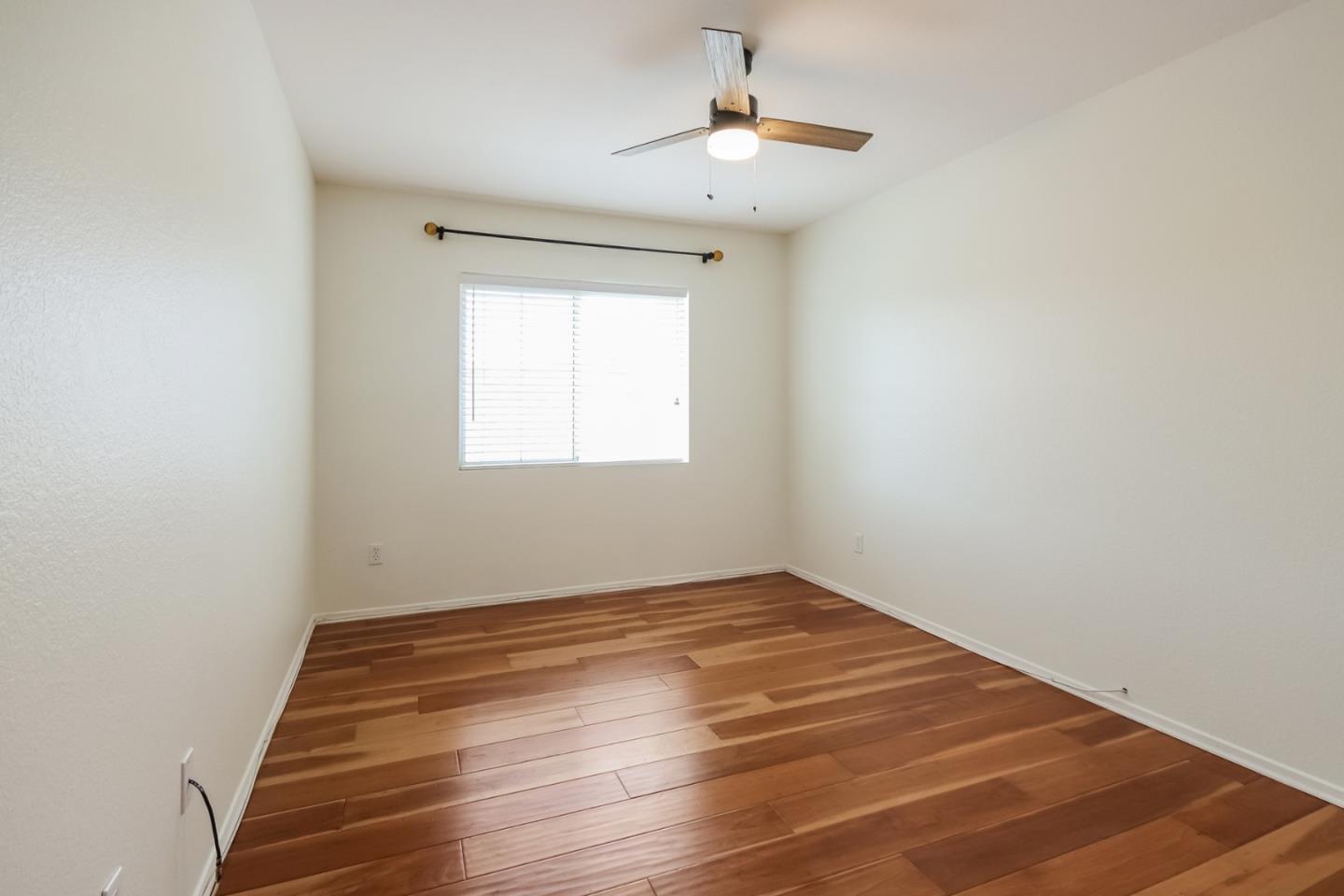 1103 Greenway Road Oceanside, CA 92057 - Photo 17 of 24 a view of empty room with wooden floor and fan