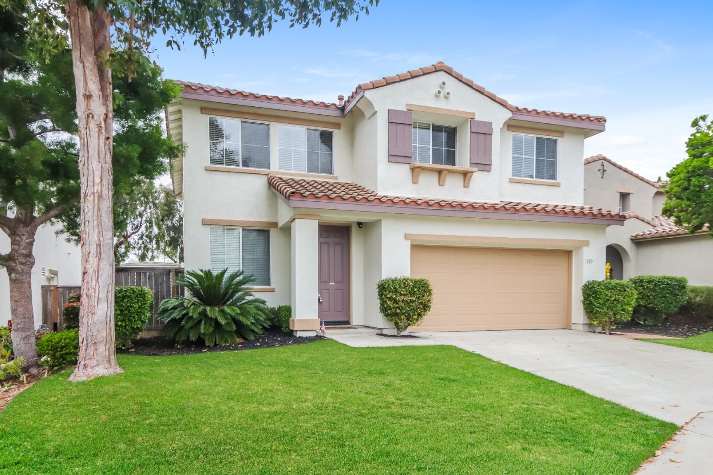 1103 Greenway Road Oceanside, CA 92057 - Photo 2 of 24 a front view of a house with a garden and plants