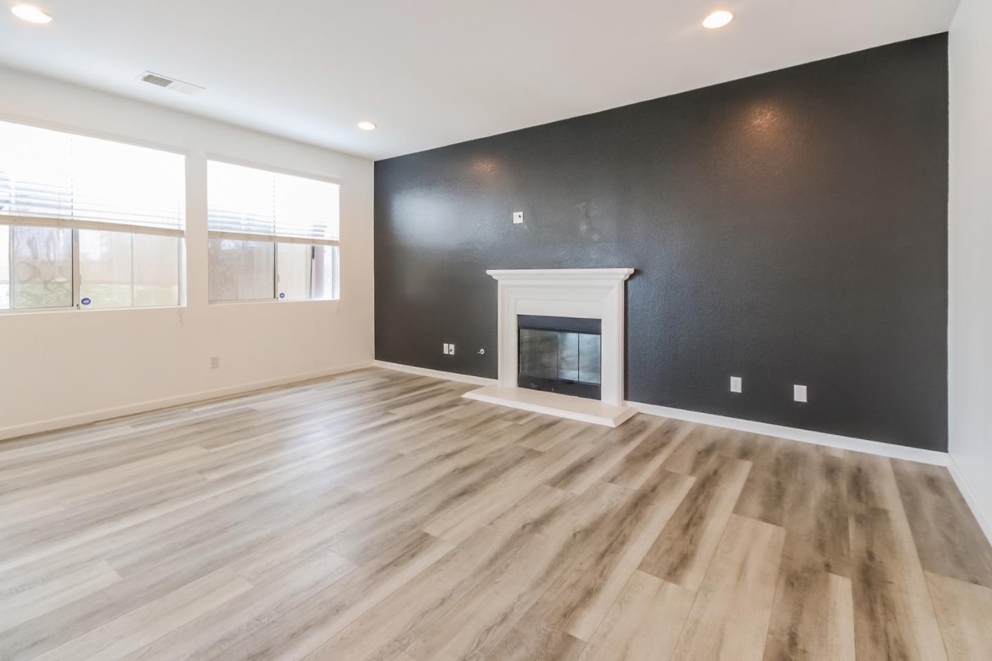 1103 Greenway Road Oceanside, CA 92057 - Photo 5 of 24 a view of empty room with wooden floor and fan