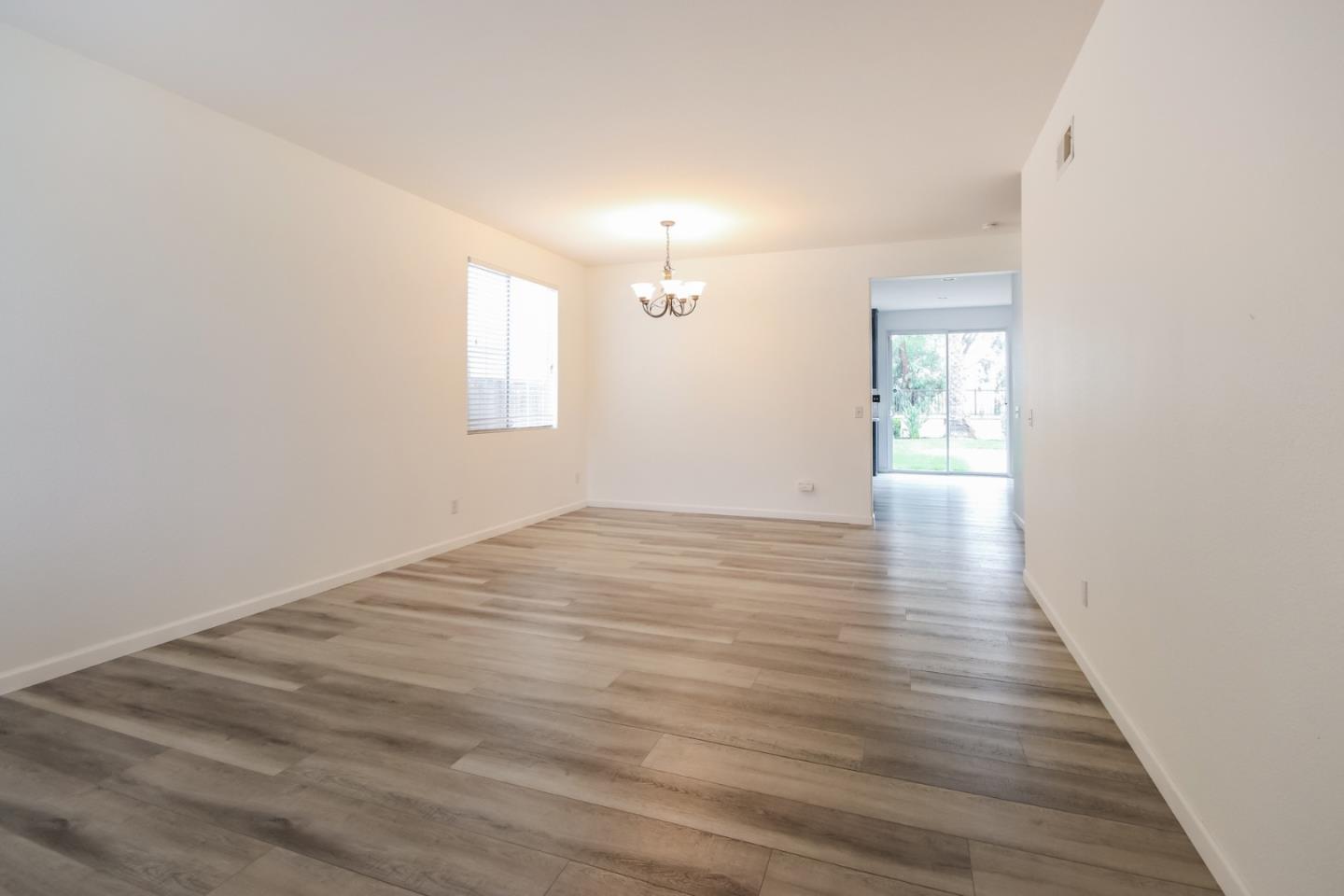1103 Greenway Road Oceanside, CA 92057 - Photo 7 of 24 wooden floor in an empty room with a window