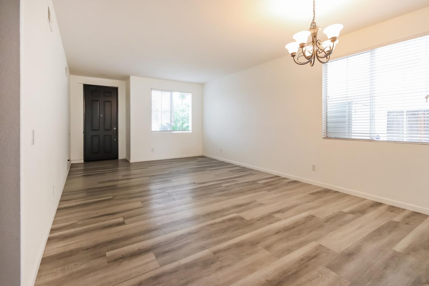 1103 Greenway Road Oceanside, CA 92057 - Photo 8 of 24 wooden floor in an empty room with a window