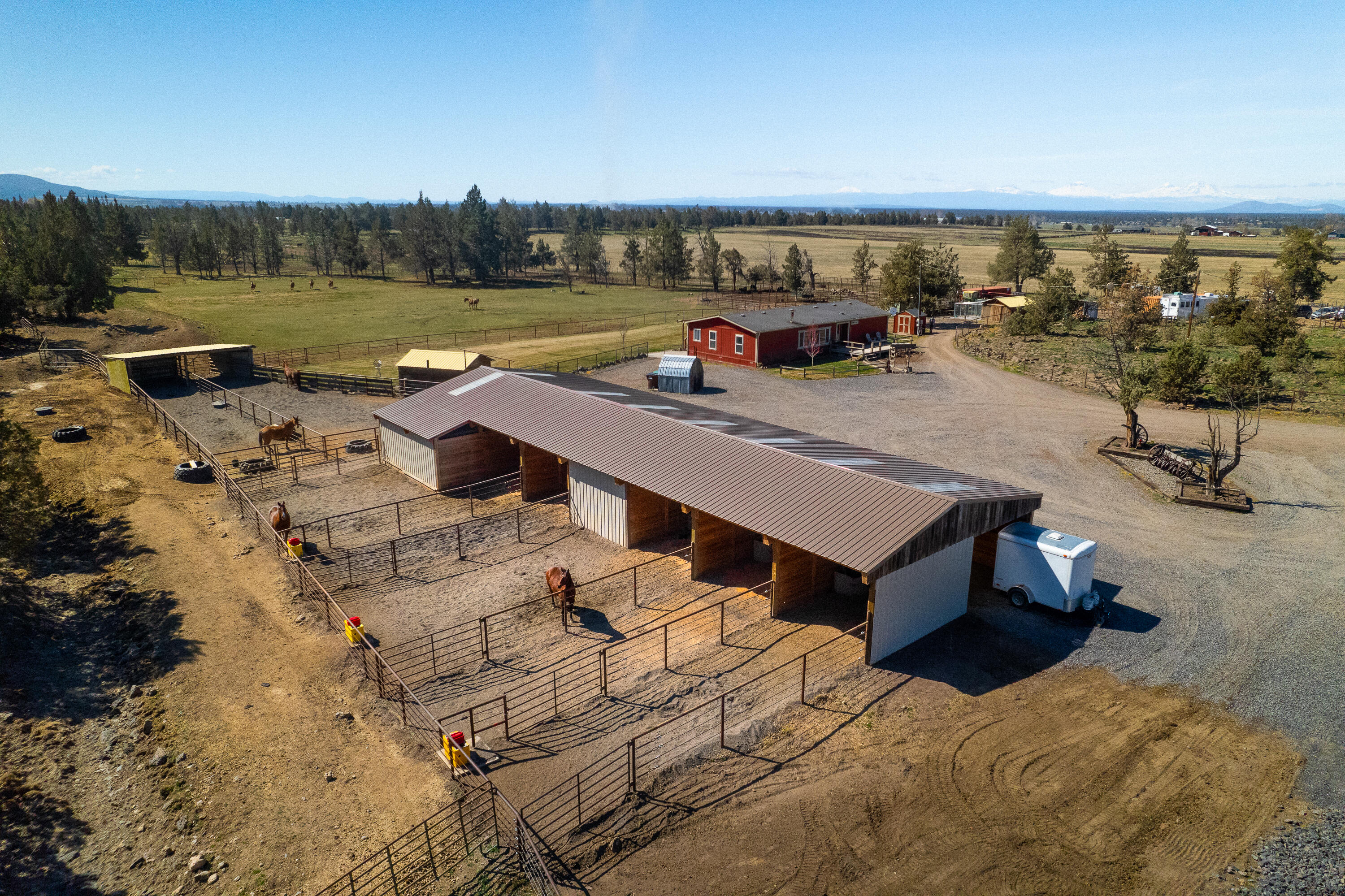 12106 Southwest Houston Lake Road Powell Butte, OR 97753 - Photo 2 of 51 East side of horse barn showing runs