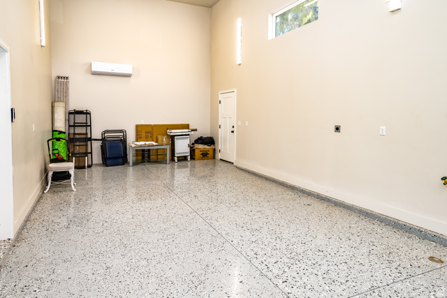 1283 North Gallen Road Santa Clara, UT 84765 - Photo 88 of 103 Large RV Garage featuring baseboards and a mini split for heating / cooling, epoxy flooring.