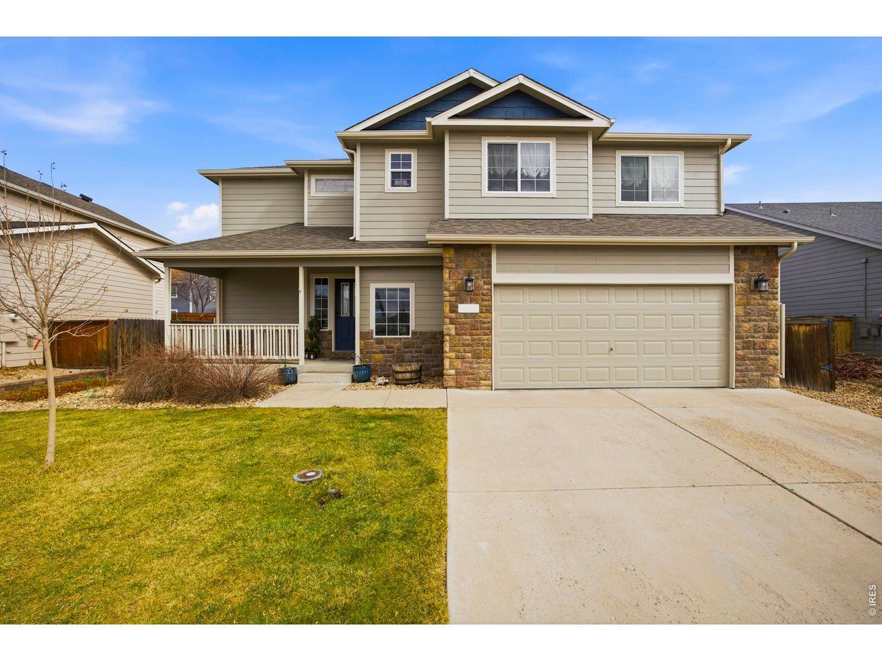 414 Prairie Clover Way Severance, CO 80550 - Photo 1 of 49 a front view of a house with a yard and garage