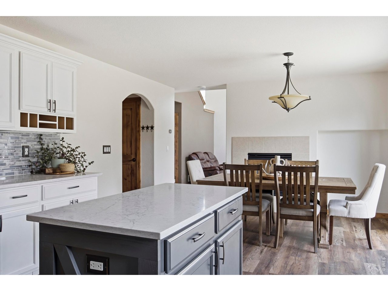 414 Prairie Clover Way Severance, CO 80550 - Photo 15 of 49 a kitchen with a table and chairs in it