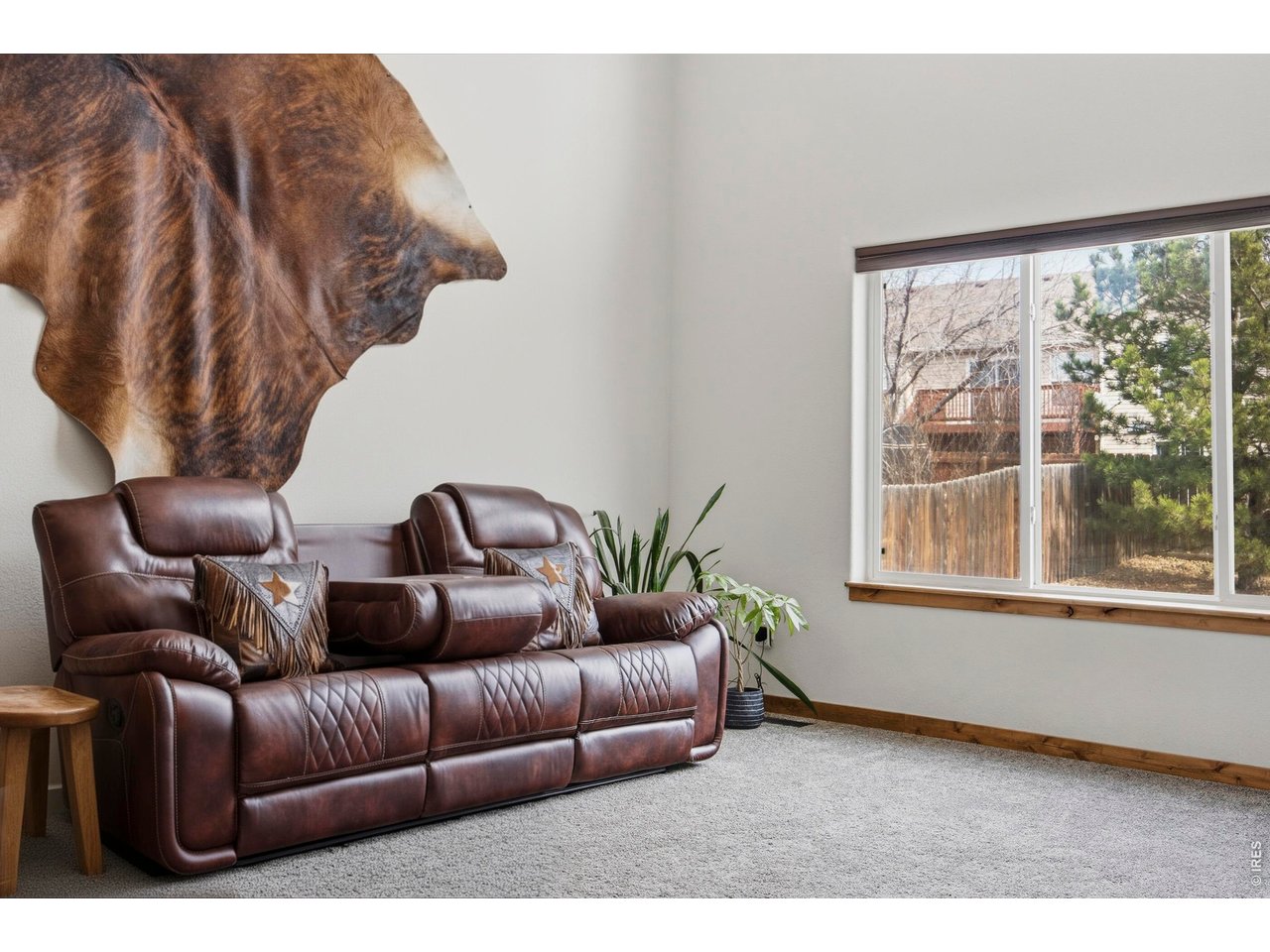 414 Prairie Clover Way Severance, CO 80550 - Photo 20 of 49 a living room with furniture and a large window