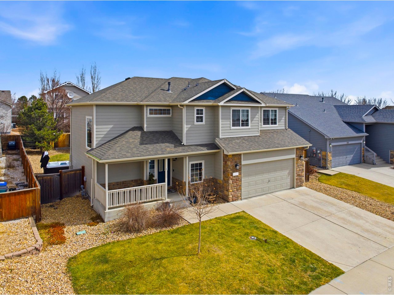 414 Prairie Clover Way Severance, CO 80550 - Photo 2 of 49 a front view of a house with swimming pool
