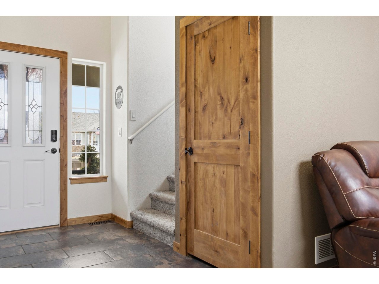 414 Prairie Clover Way Severance, CO 80550 - Photo 22 of 49 a view of entryway with wooden floor