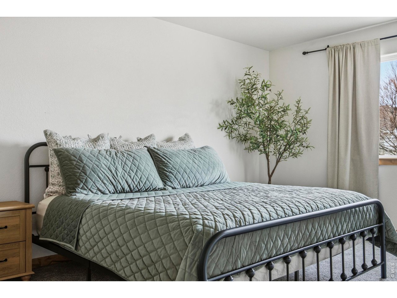 414 Prairie Clover Way Severance, CO 80550 - Photo 23 of 49 a bedroom with a bed and a window