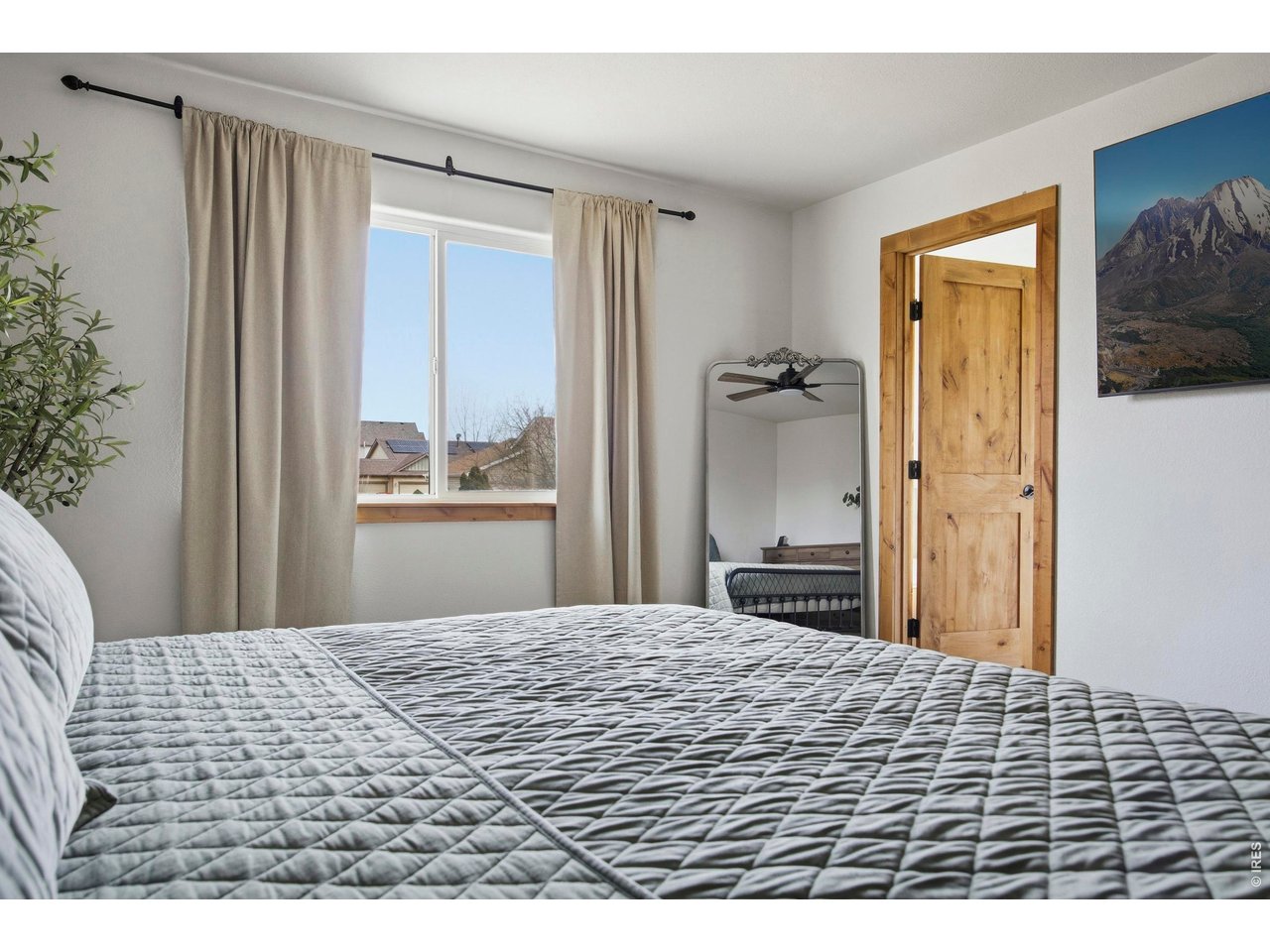 414 Prairie Clover Way Severance, CO 80550 - Photo 25 of 49 a bedroom with a bed and a window