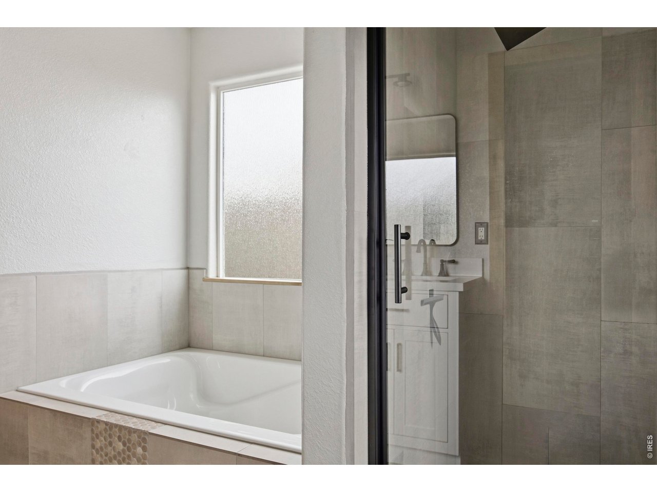 414 Prairie Clover Way Severance, CO 80550 - Photo 27 of 49 a bathroom with a bathtub