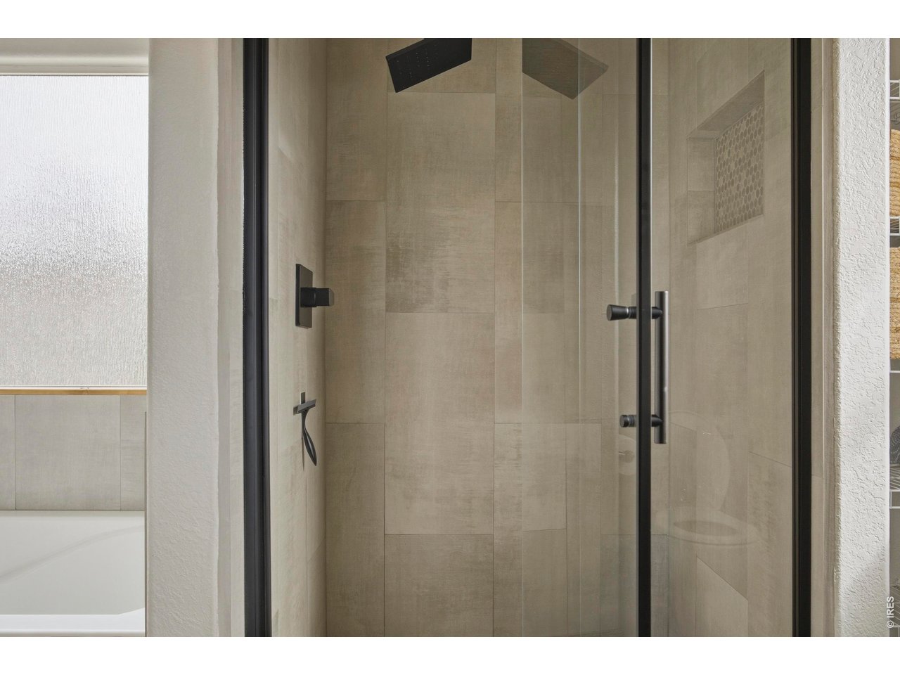 414 Prairie Clover Way Severance, CO 80550 - Photo 28 of 49 a bathroom with a shower