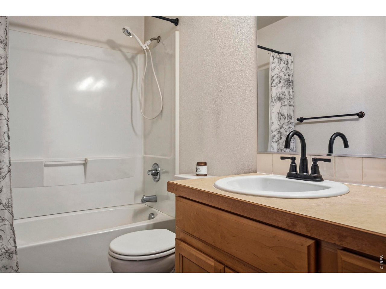 414 Prairie Clover Way Severance, CO 80550 - Photo 33 of 49 a bathroom with a sink a toilet and shower